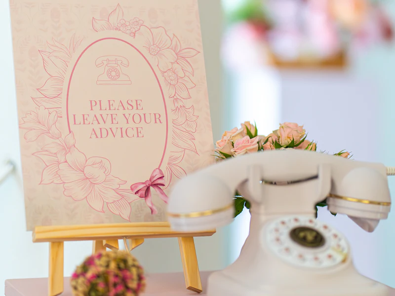 Vintage audio guestbook phone with an instruction card at an event